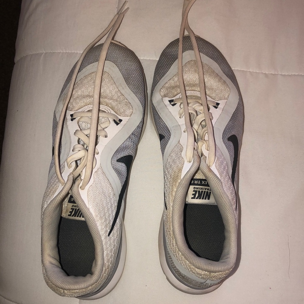white and gray an black nike shoes